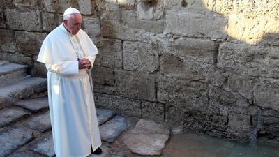 Pope Francis prays on a visit to Bethany on May 24, 2014, a site on the eastern bank of the River Jordan where Christians believe Jesus was baptised. Sami Khahman/AFP Photo