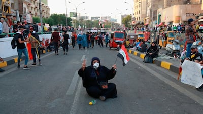 An Iraqi woman takes part in the anti-government protests in Baghdad. AP