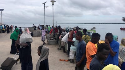 Travellers gather at the Lamu jetty following an attack by Al Shabab militants. Reuters