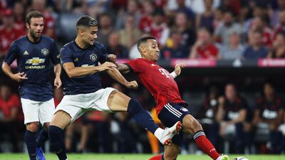 Bayern Munich's Thiago is challenged by Manchester United's Andreas Pereira. Getty Images