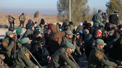Members of the Syrian security forces at the camp. AFP