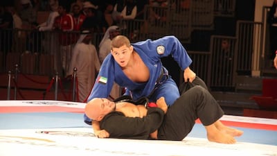 Jose Junior (blue) on his way to victory over Mauricio Henrique Lima in the semi-finals of the Grand Slam Abu Dhabi at the Ipic Arena on January 14, 2017. Amith Passela / The National