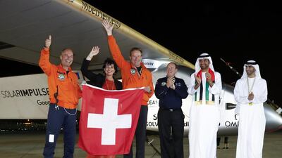 Dr Sultan Al Jaber, Minister of State, with from left, Bertrand Piccard, the Swiss pilot of Solar Impulse 2, Doris Leuthard, the Swiss energy minister, Andre Borschberg, Swiss co-pilot, and Prince Albert II of Monaco and Dr Thani Al Zeyoudi, Minister of Environment and Climate Change after the plane landed in Abu Dhabi. Peter Klaunzer / EPA