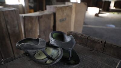 A discarded pair of sandals in Government Science College dormitory, in Kagara. Hundreds of pupils rushed to flee their dormitories when the armed gang descended. AFP