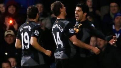 Liverpool's Luis Suarez, right celebrates scoring against Queens Park Rangers.