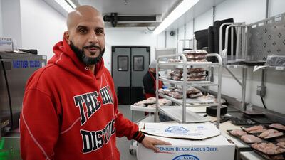 Abdullah Salem and his team prepare meat before it is sent to the shelves