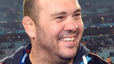 Michael Cheika, pictured in August 2, 2014 after coacing the New South Wales Waratahs past the Canterbury Crusaders in the Super 15 rugby union final in Sydney. Now coaching the Australian national team, Cheika says Australia makes make its leagues 'so good that players don't want to leave, because they are enjoying themselves and getting what they want out of rugby". William West / AFP