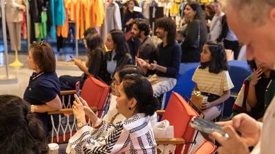 Fans capture the event.