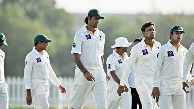 Mohammad Irfan, center, and Pakistan walk off the field after a practice match against the UAE in Abu Dhabi. Jeff Topping / For The National