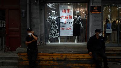 China's shoppers are 'happy to buy cheaper brands' amid a call from the government to avoid excessive consumption, analysts have said. AFP