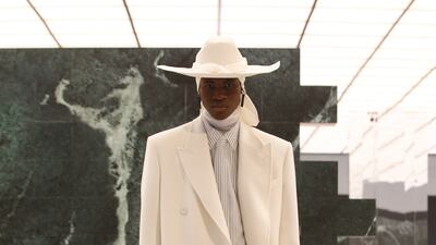 Wearing a durag, and a coat cut to trail on the floor, a model appears in the autumn/winter 2021 show, Louis Vuitton menswear, by Virgil Abloh. Photo: Louis Vuitton