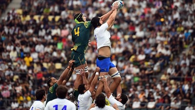 Australia lock Rob Simmons and Uruguay lock Manuel Leindekar vie for the ball. AFP