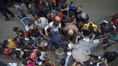 Palestinian Walid al-Hattab prepares soup for the poor during Ramadan in Gaza City on April 24, 2020. AFP