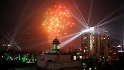 Fireworks and laser lights illuminate the sky during the Poush Sankranti celebration in Old Dhaka. EPA