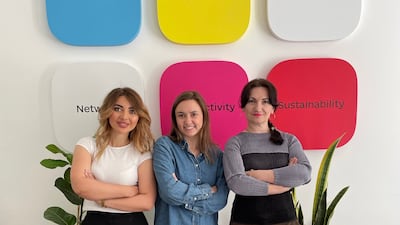 Alexandra Iliashenko (C) with her colleagues in Warsaw at the branch office that opened last month. Photo: Diia.Business
