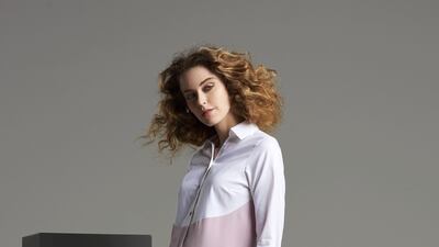 Asymmetrical panelling gives a unique twist to a classic white blouse.