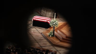 The casket of John McCain sits in the nave during the funeral service at the National Cathedral. Getty Images/ AFP