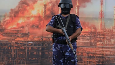 A member of the Houthi security forces stands guard during an anti-Saudi Arabia protest in Sanaa, Yemen, on July 31. EPA