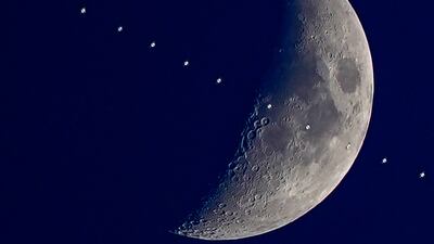 A multiple exposure photograph shows the International Space Station with the Moon in the background above Liverpool on Monday. PA