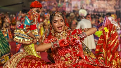 A woman dances during celebrations of the Hindu festival of Navratri in Mumbai, India. EPA
