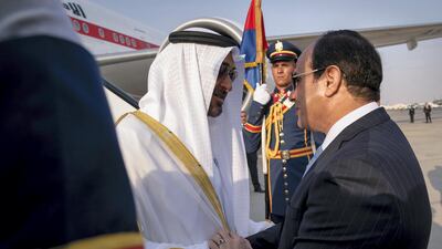Sheikh Mohammed bin Zayed, Crown Prince of Abu Dhabi and Deputy Supreme Commander of the UAE Armed Forces (L), is received by Abdel Fattah El Sisi, President of Egypt (R), upon arrival at Cairo international Airport, commencing an official visit. Mohamed Al Hammadi / Crown Prince Court - Abu Dhabi