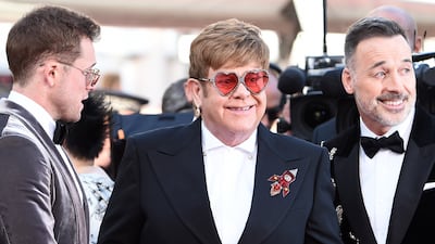 Elton John, in a black suit with a rocket detailing and heart-shaped sunglasses, attends the screening of 'Rocketman' during the 72nd Annual Cannes Film Festival on May 16, 2019. Getty Images
