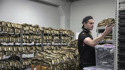 A worker checks donated medical supplies stored at a warehouse in Kyiv. Bloomberg