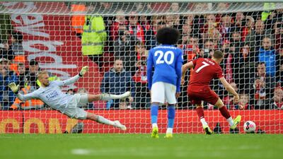 Milner sends Schmeichel the wrong way and scores the winning goal from the spot. EPA