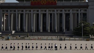 Children leave after a ceremony in memory of national heroes on Martyrs' Day in Tiananmen Square, Beijing, China. EPA