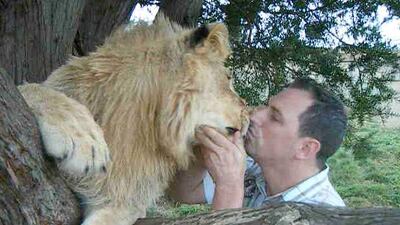 Rob Punton says he has developed training methods to rehabilitate abused or injured cats, and improve the lives of those born in captivity.