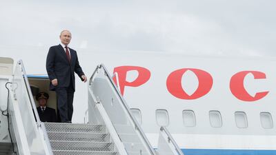 Russian President Vladimir Putin boards a plane upon departure in Anchorage, Alaska. Reuters