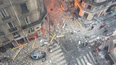 A view of the debris and car wreckage following the explosion at a bakery on the corner of the streets Saint-Cecile and Rue de Trevise in central Paris. AFP / Carl LABROSSE