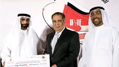 From left, Mohammed Ahmed Al Bawardi, undersecretary of Sheikh Mohammed bin Zayed, Crown Prince of Abu Dhabi, the Egyptian author Youssef Ziedan and the managing director of the Emirates Foundation, Ahmed Ali Al Sayegh, awarding the author with the 2009 International Prize for Arabic Fiction for his novel Azazel.