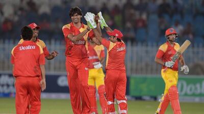 Islamabad United bowler Mohammad Irfan, centre, celebrates after taking a wicket. Aamir Qureshi / AFP