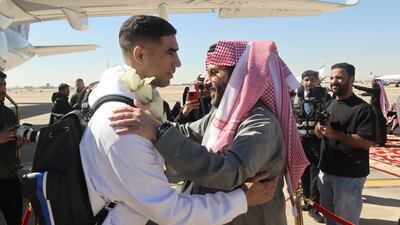 PSG's Achraf Hakimi is welcomed upon arrival. Reuters