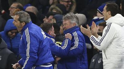Chelsea coaches celebrate with interim manager Guus Hiddink after the late equaliser on Saturday against Everton at Stamford Bridge. Justin Tallis / AFP
