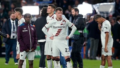 Bayer Leverkusen's Jeremie Frimpong, Adam Hlozek and Amine Adli, from left, after their Europa League final defeat. PA