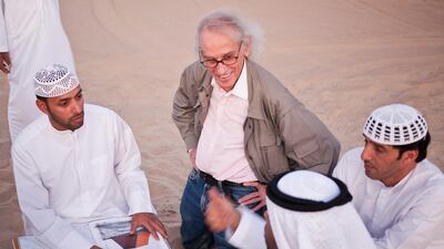 Christo with Khalfan Al Qubasi, left, Saeed Al Falahi, right, and Obaid Al Mazrouei, front right, in Liwa. Antonie Robertson / The National