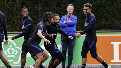 Left to right: Tyrell Malacia, Nathan Ake, Memphis Depay, manager Louis van Gaal and Donyell Malen. EPA