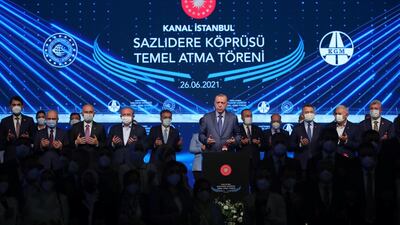 Turkish President Recep Tayyip Erdogan prays during the ground-breaking ceremony of Sazlidere Bridge in Istanbul on June 26, 2021. Reuters
