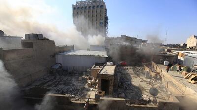 Smoke rises from the site of a bomb attack near Khullani Square in Baghdad on Wednesday. Ahmed Saad / Reuters