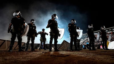 Police officers stand during the Serbian Cup semi-final. AFP
