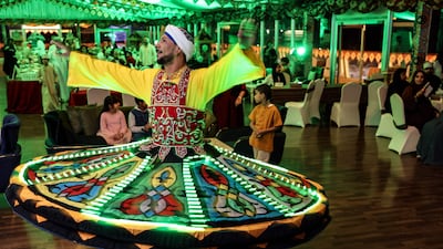 An Egyptian dancer performs the traditional tanoura dance at a restaurant in the Omani capital Muscat. AFP