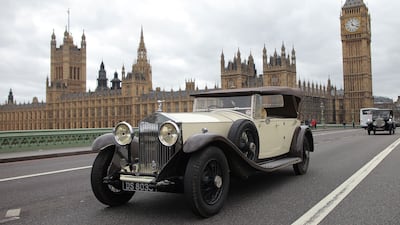 A vintage Rolls-Royce drives through London in 2011, during a parade celebrating the 100th anniversary of the 'Spirit of Ecstasy' emblem.