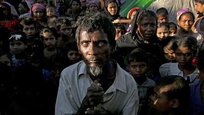 Ahmed, 50, is blind in one eye from lack of medical care surrounded by Rohingya families at a tented IDP camp November 24, 2012 on the outskirts of Sittwe, Paula Bronstein/Getty Images