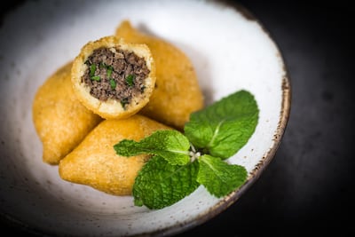 Kubbat Halab, a fried croquette of yellow rice stuffed with lamb. Philip Juma