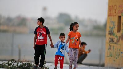 Children play at the border between Turkey and Syria near the Turkish town of Akcakale October 8, 2019. AP