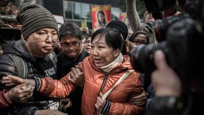 Former Indonesian maid Erwiana Sulistyaningsih, centre, arriving at the court of justice in Hong Kong on February 10, 2015. Her former employer was convicted of mistreating her in a case that sparked international outrage. Philippe Lopez/AFP Photo