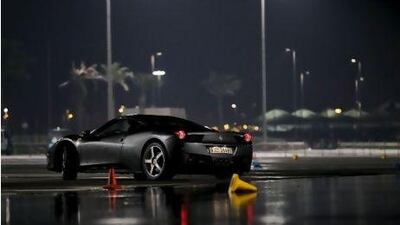 On a wet skidpad at Yas Marina, the 458 Italia is still composed. Pawel Dwulit / The National