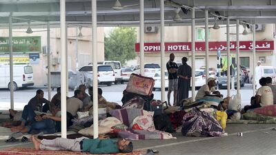 Tenants of an apartment building in Sharjah take temporary shelter at a nearby mosque after being evicted. The National
